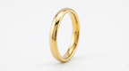 thin Gold ring on a white background