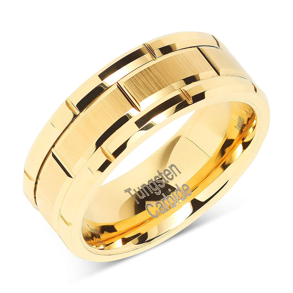 Gold tungsten carbide ring on a white background
