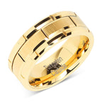 Gold tungsten carbide ring on a white background