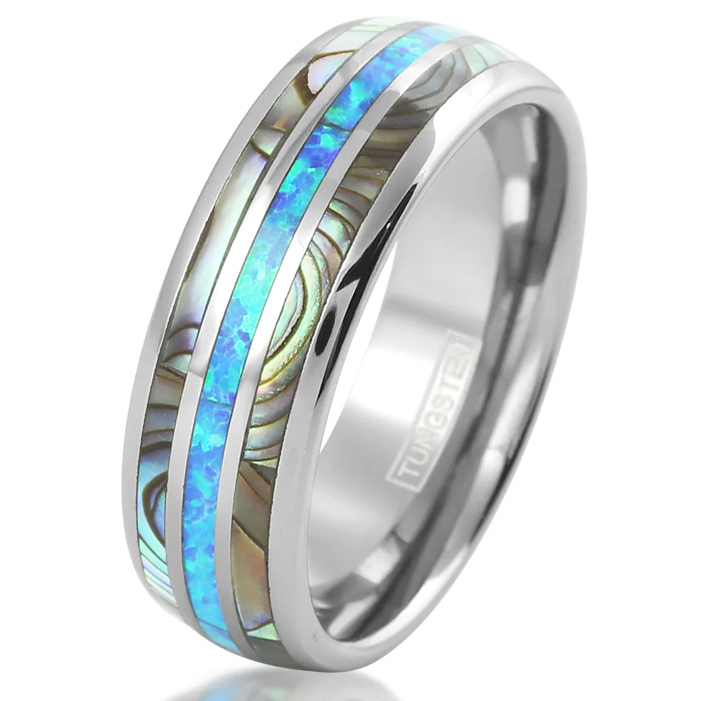 Silver ring with blue and green inlay on a white background