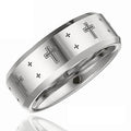 Silver ring with cross designs on a white background