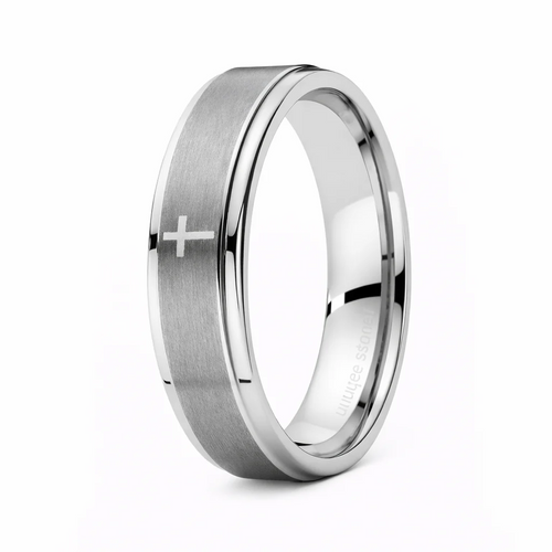 Silver ring with a cross engraving on a white background