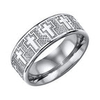 Silver ring with intricate design of crosses on a white background