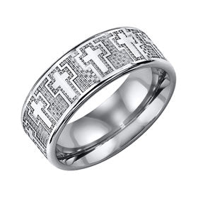 Silver ring with intricate design of crosses on a white background