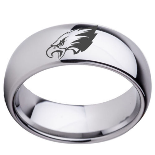 Silver ring with an eagle emblem on a white background
