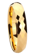 Gold ring with a faceted design on a white background