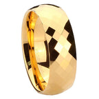 Gold ring with a faceted design on a white background
