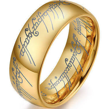Gold lord of the rings ring with engraved text on a white background
