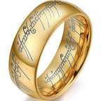 Gold lord of the rings ring with engraved text on a white background