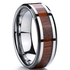 Ring with wooden inlay on a reflective surface